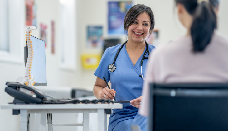 A nurse talking to a doctor